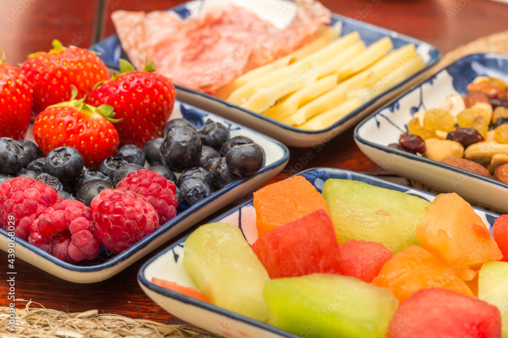 Healthy breakfast with fresh fruit, nuts and cheese Healthy breakfast with fresh fruit, nuts and cheese