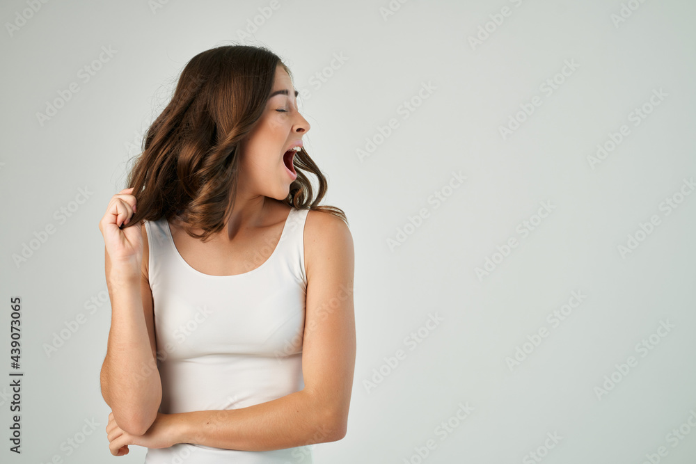 emotional brunette fashion hairstyle white tank top isolated background model emotional brunette fashion hairstyle white tank top isolated background model