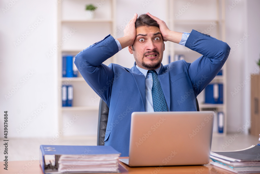 Young businessman employee working in the office Young businessman employee working in the office