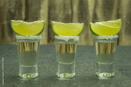 The glasses are filled with tequila and lime and salt