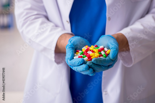 Young male doctor and too many pills