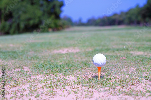 A white golf ball in golf field on blur background 1