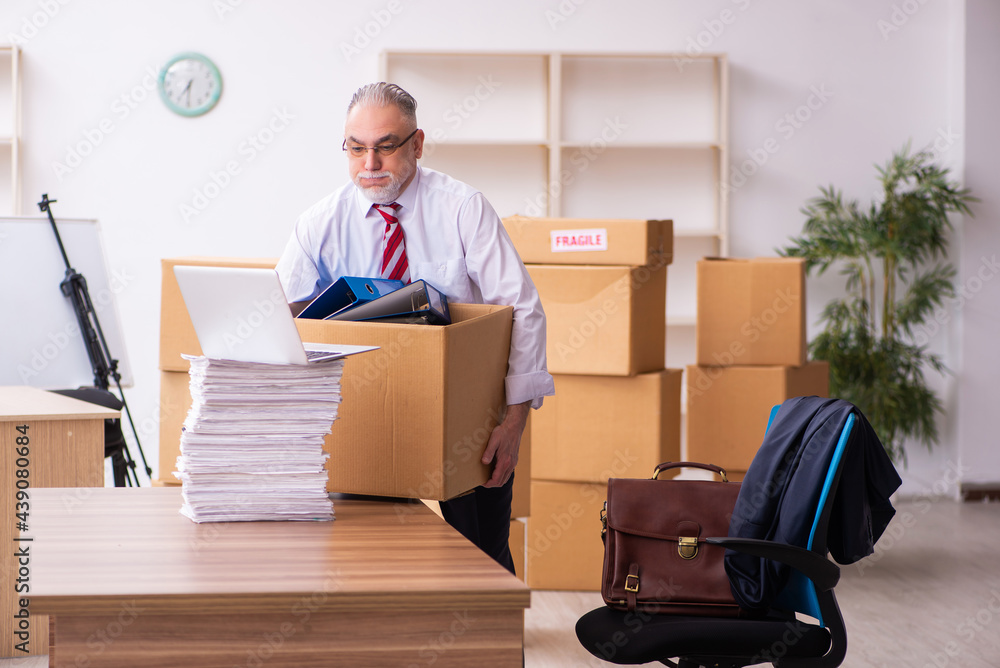 Old businessman employee in relocation concept Old businessman employee in relocation concept