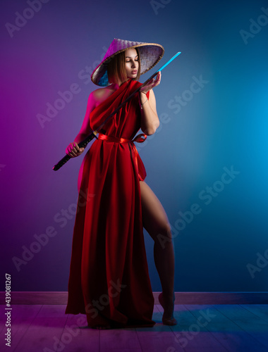 sexy woman in a red cape and an Asian hat with a katana in her hand image of a samurai in neon color