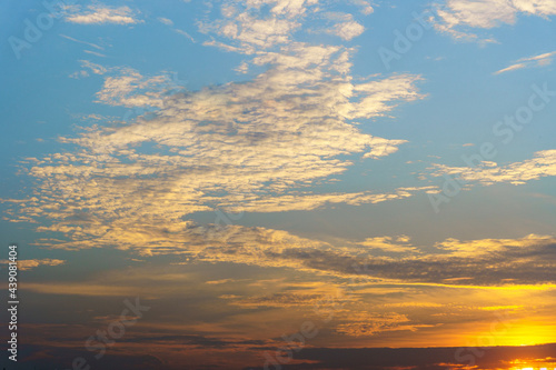 Sky and clouds in the evening with beautiful colors. The sky is blue and gold.