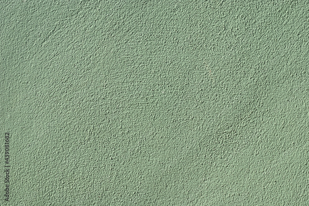 Fototapeta premium Semi gloss green cement texture. An earth tone color and touch make a blend of nature feeling in modern habitat. Cool and calm wallpaper background.