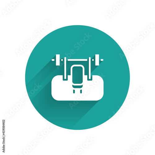 White Bench with barbel icon isolated with long shadow. Gym equipment. Bodybuilding, powerlifting, fitness concept. Green circle button. Vector