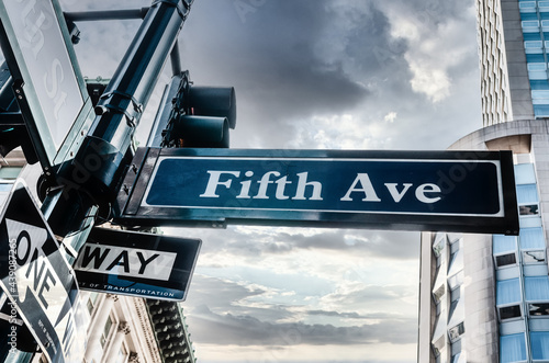 Blue Fifth Ave Sign with cloudy skiy, low angle in New York, USA photo
