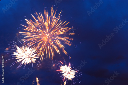 Brightly colorful fireworks and salute of various colors in the night sky. Independence Day, 4th of July, Fourth of July or New Year.