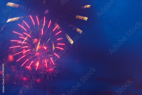 Brightly colorful fireworks and salute of various colors in the night sky. Independence Day, 4th of July, Fourth of July or New Year.