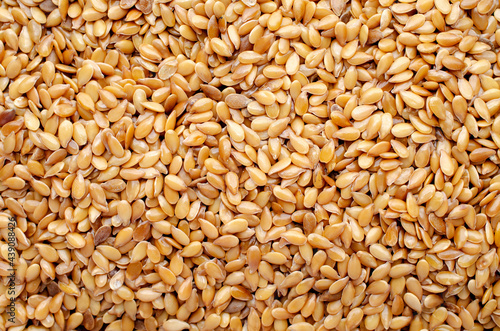 Top view of dry golden flax seed background