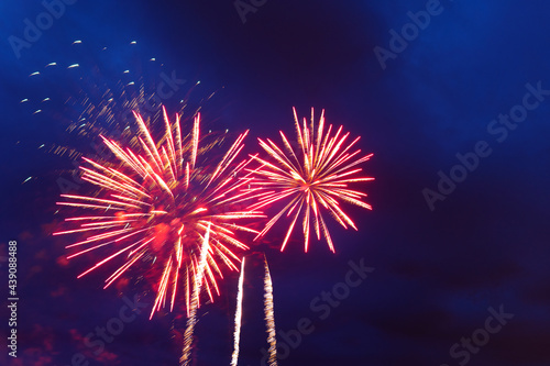 Brightly colorful fireworks and salute of various colors in the night sky. Independence Day, 4th of July, Fourth of July or New Year.