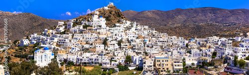 Picturesque authentic Ios island. View of scenic old town Chora with whitewashed houses and blue churches © Freesurf