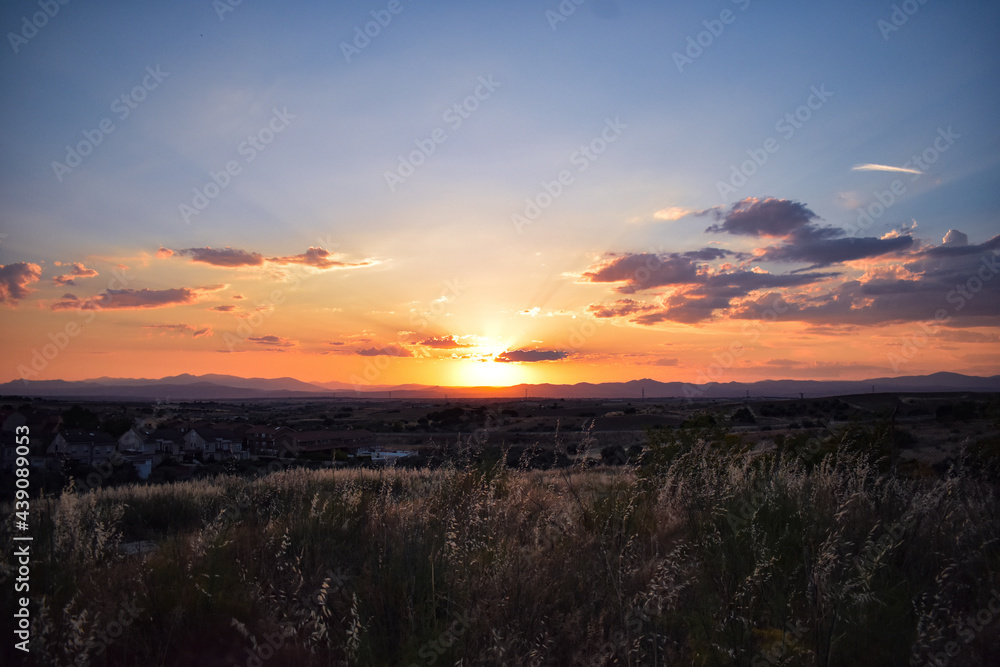 Sunset photo with clouds and distant mountains Sunset photo with clouds and distant mountains