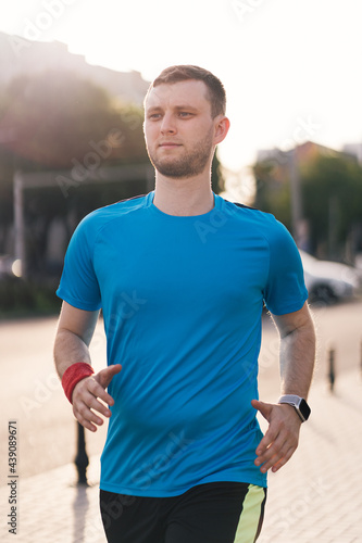 Man running in the city. Fitness workout, sport lifestyle concept.