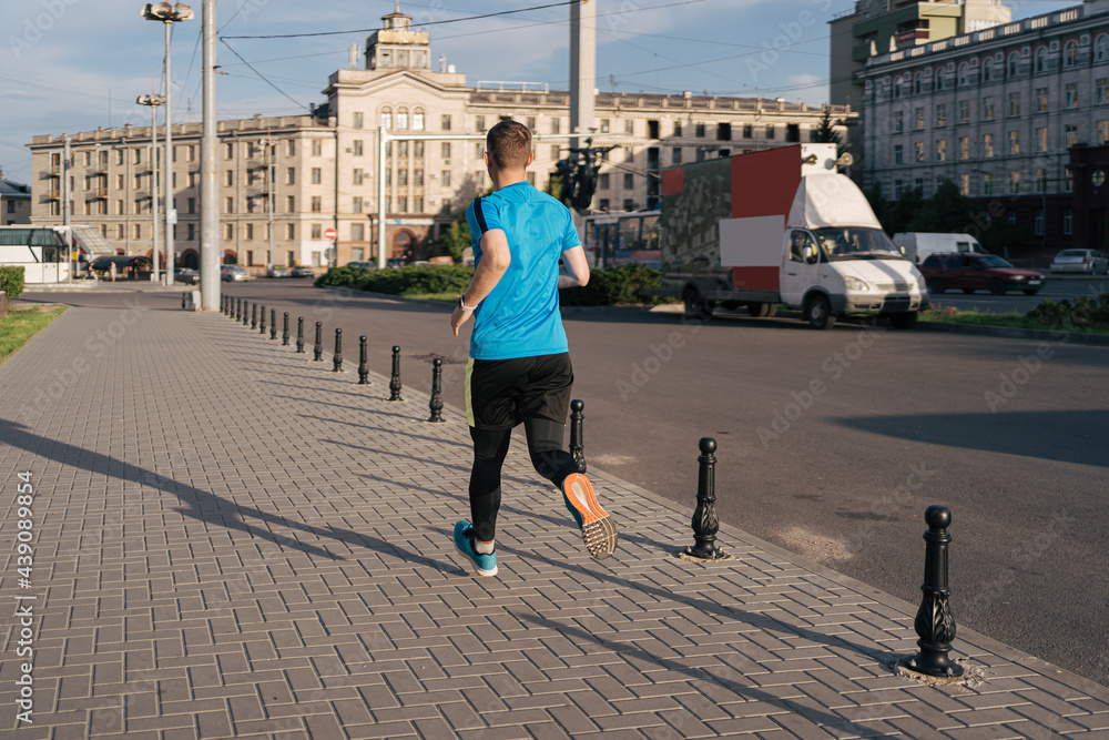 Man running in the city. Fitness workout, sport lifestyle concept.