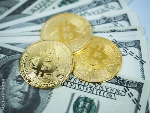 Closeup bitcoins on money bill dollar digital money concept