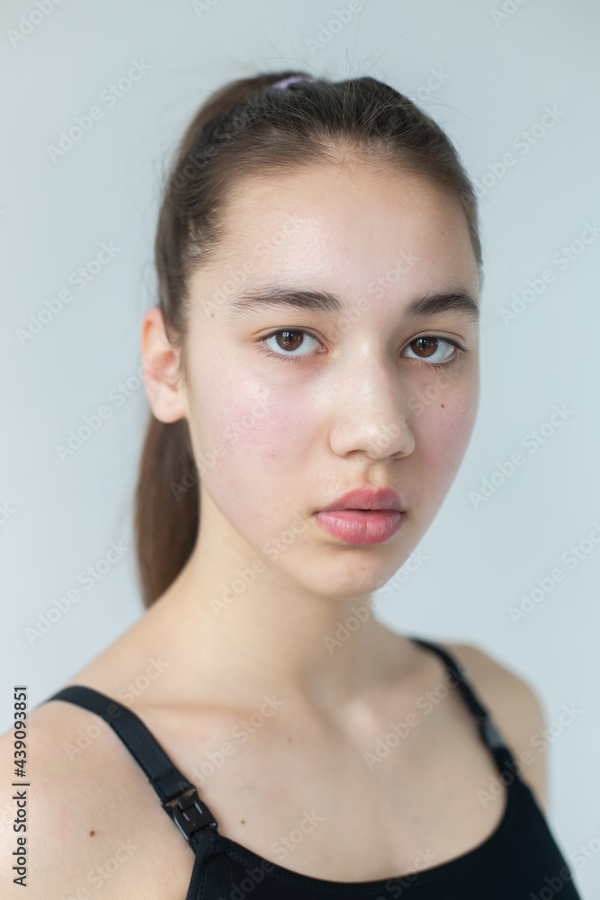 Natural beauty brunette model no make up in swimsuit posing in studio on isolated background. Model tests, natural no make up models concept Natural beauty brunette model no make up in swimsuit posing in studio on isolated background. Model tests, natural no make up models concept
