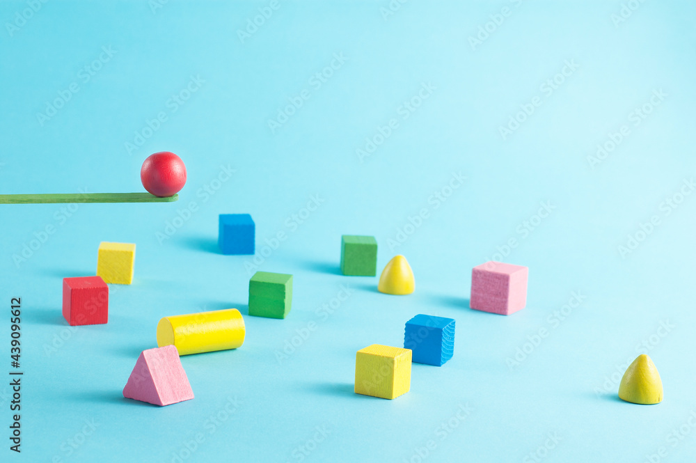Minimal conceptual image with color geometric figures jumping from a springboard