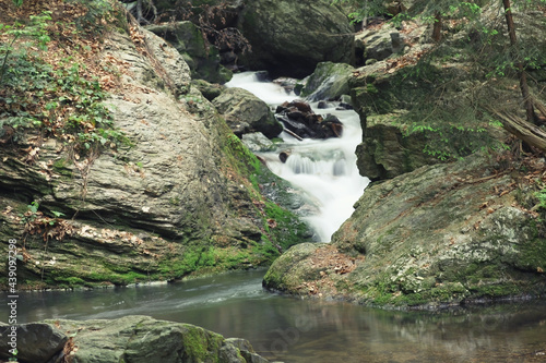 Silky effect of waterfall running in a brook at Resovske vodopady in Czech Republic.  photo