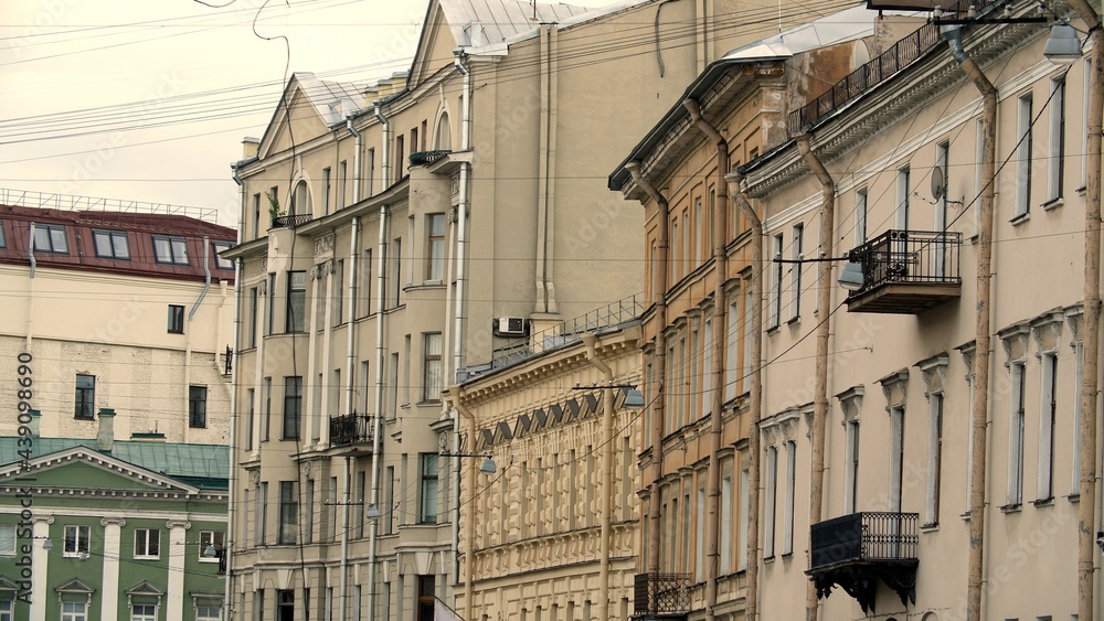 Old beautiful residential building in the center of St. Petersburg, Russia. Beautiful architecture in the city center. Exterior of residential building with many apartments. Old beautiful residential building in the center of St. Petersburg, Russia. Beautiful architecture in the city center. Exterior of residential building with many apartments.