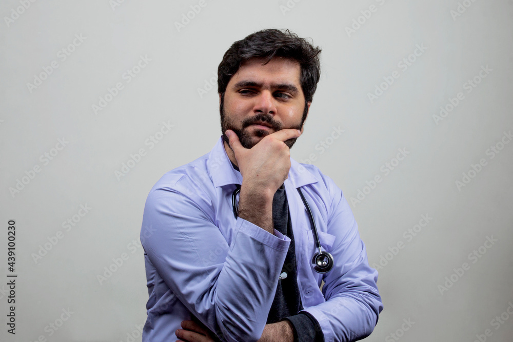 A doctor looking side ward thinking something A doctor looking side ward thinking something