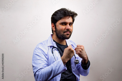 A doctor with joyful gesture pointing forward