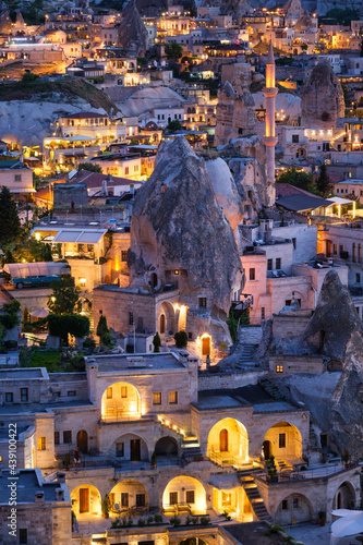 Goreme, Cappadocia, Turkey. View of the evening city from the mountain. Brigh...