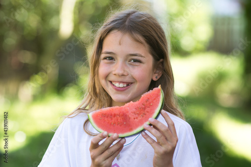 Young girl is eating water melon. Vacation, summer and holidays concept.