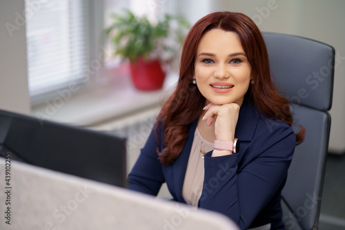 Caucasian woman working laptop. Business woman busy working on laptop computer at office.