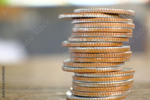 Close up golden coins on table background and saving money and business growth concept, finance and investment concept