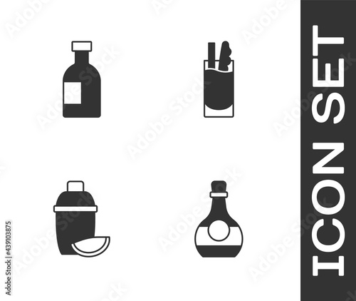 Set Bottle of cognac or brandy, Glass bottle vodka, Cocktail shaker with lime and Bloody Mary icon. Vector