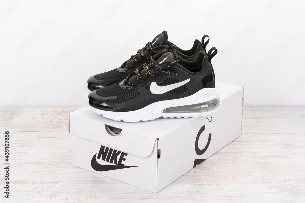 BURGAS, BULGARIA - DECEMBER 8, 2020: Nike Air MAX 270 REACT women's shoes -  sneakers in black on white wooden background. Nike is a global sports  clothes and running shoes retailer Stock Photo | Adobe Stock