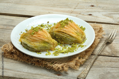 midye baklava is turkish desserts with pistachio photo