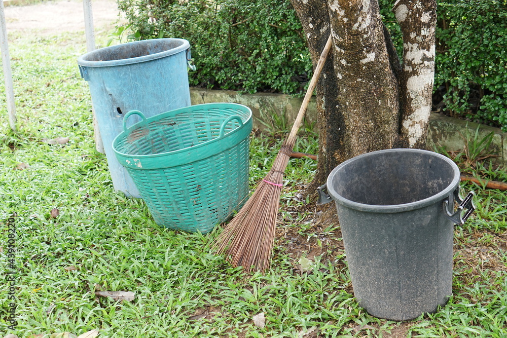 Trash and brooms were left under the shade of the trees. Trash and brooms were left under the shade of the trees.