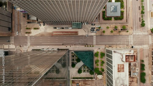Aerial birds eye overhead top down view of wide multilane downtown streets with low traffic. Horizontally panning view. Dallas, Texas, US photo