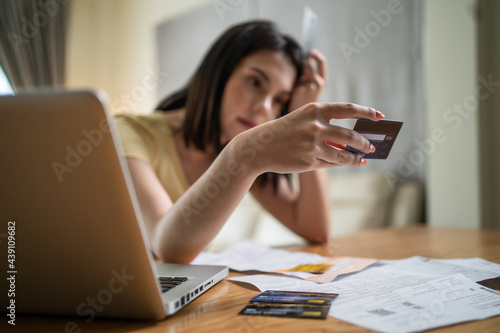 Caucasian young girl feeling stressed from financial problem and debt.	 photo