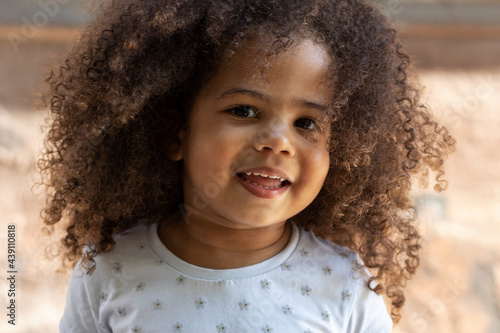 Close-up portrait of a curly african american girl.