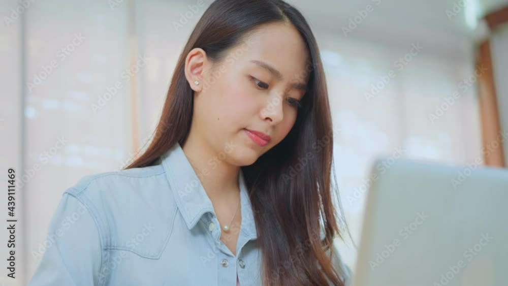 Asian Business woman distance learn online, typing on computer at home Asian Business woman distance learn online, typing on computer at home