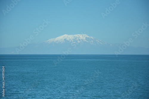 view of the lake and peak snowy mountain. van lake and Mount Suphan in turkey.