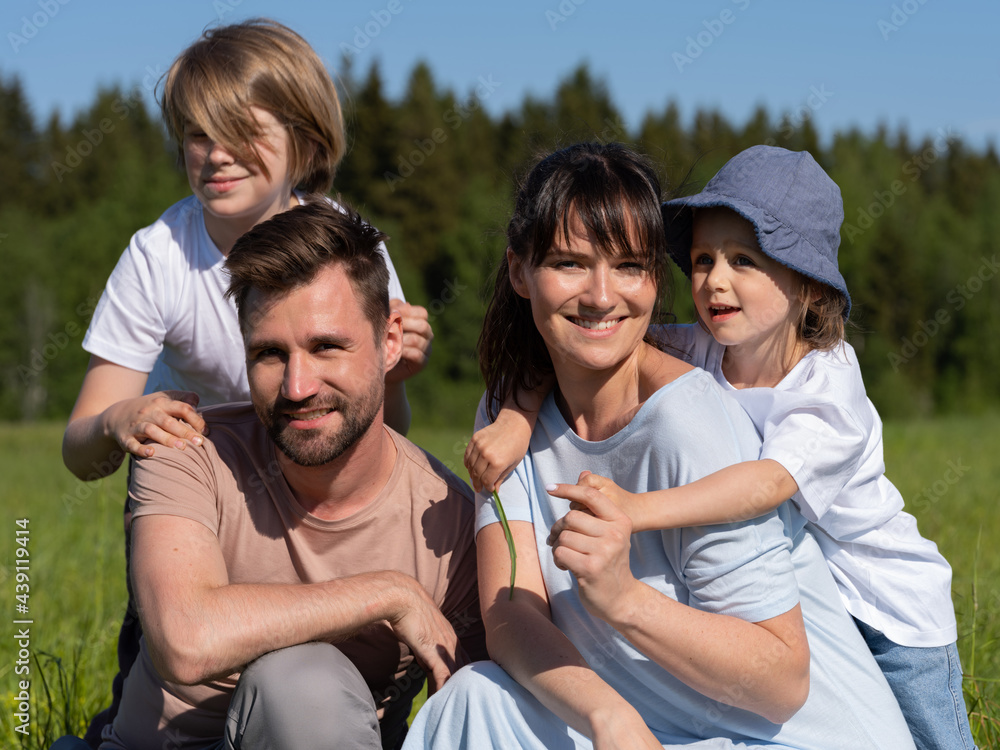 Fototapeta premium Family outdoors smiling