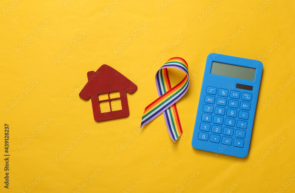 Calculator with house, LGBT rainbow ribbon pride tape symbol on yellow background. Calculator with house, LGBT rainbow ribbon pride tape symbol on yellow background.