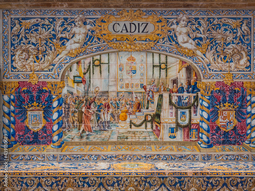 bench in the plaza españa in seville, representing historical events in Cadiz in Pisan tiles and with two towers of shelves on the sides.