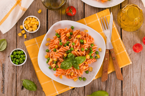 Fusilli pasta with peas and sweet corn.