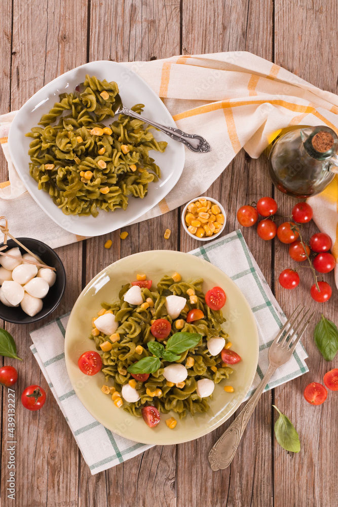 Fusilli pasta with cherry tomatoes and sweet corn. Fusilli pasta with cherry tomatoes and sweet corn.