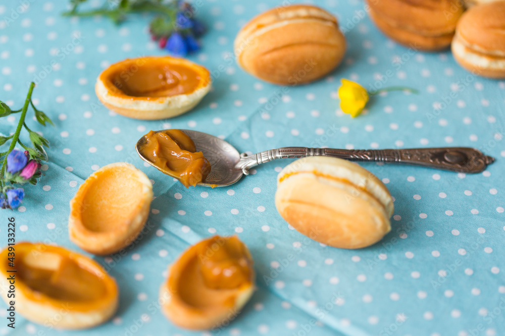 Homemade Russian traditional cookies or cakes in the shape of nuts filled with boiled condensed milk Homemade Russian traditional cookies or cakes in the shape of nuts filled with boiled condensed milk