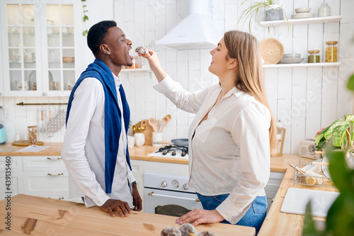 Happy love couple cooking breakfast on the kitchen