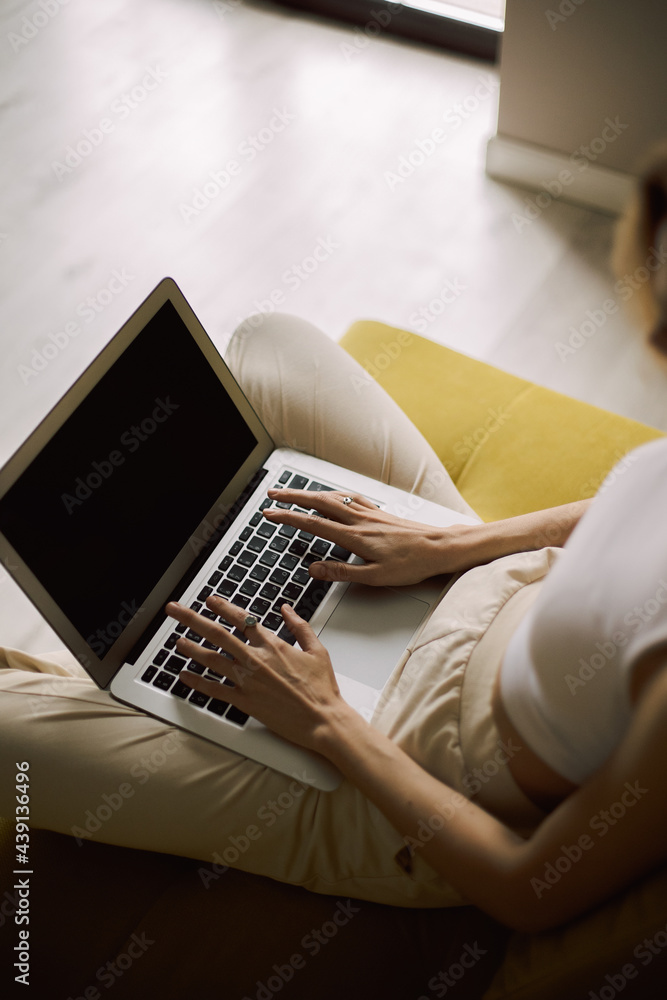 Fototapeta premium woman typing on a laptop
