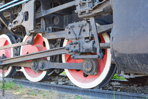 Close-up of a wheel of a retro steam locomotive.