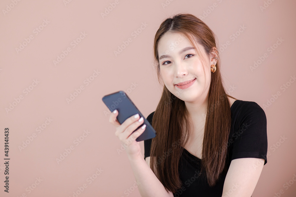 Portrait of beautiful Asian woman use the mobile phone happily Portrait of beautiful Asian woman use the mobile phone happily